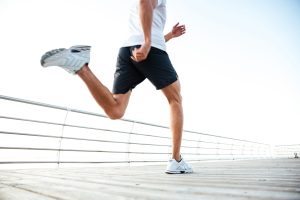 Cropped,Image,Of,Man,Athlete,Runner's,Feet,And,Shoes,Running